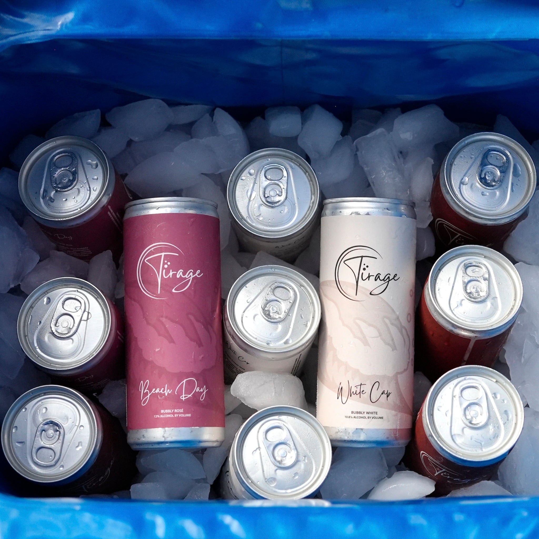 Cans of 'Tirage' wine on ice in a cooler